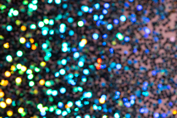 istock Colorful prism confetti blurred festive backdrop, trendy sparkles and glitter background, flat lay style. Christmas and holidays concept 1179186538