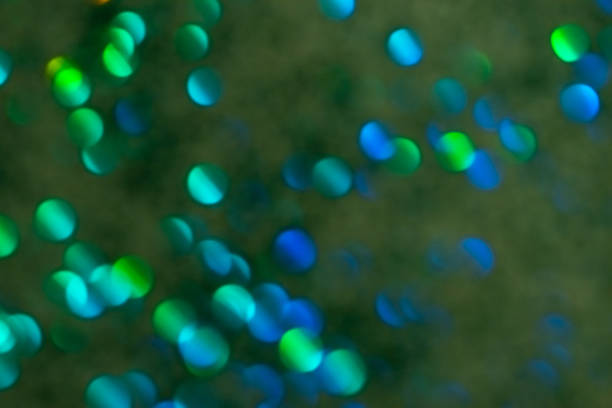 Colorful prism confetti blurred festive backdrop, trendy sparkles and glitter background, flat lay style. Christmas and holidays concept