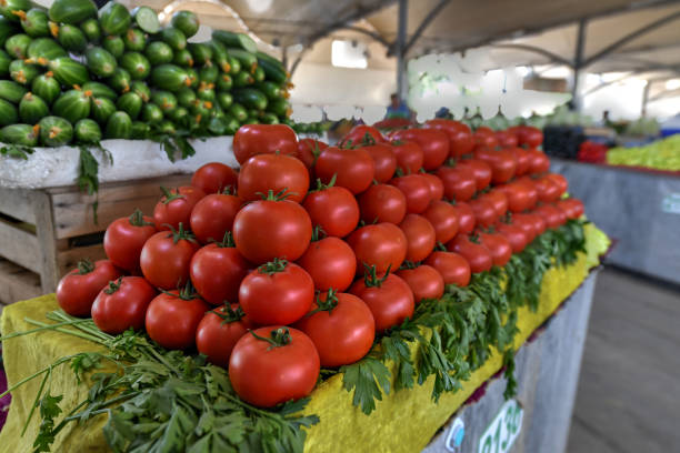 Organic tomatoes sale on market stall