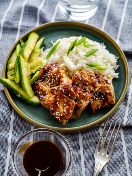 Hoisin Chicken. Traditional Asian cuisine. Chicken with sauce, rice and pickled cucumbers. Hoisin Chicken. Traditional Asian cuisine. Chicken with sauce, rice and pickled cucumbers hoisin sauce stock pictures, royalty-free photos & images