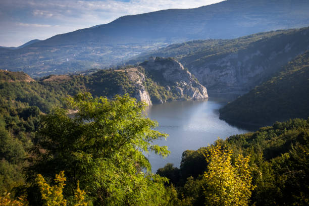 istock River surrounded by the hills and mountains 1179192136