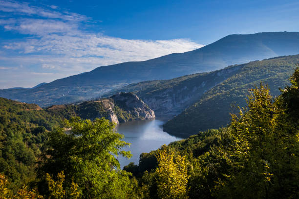 istock River surrounded by the hills and mountains 1179192137