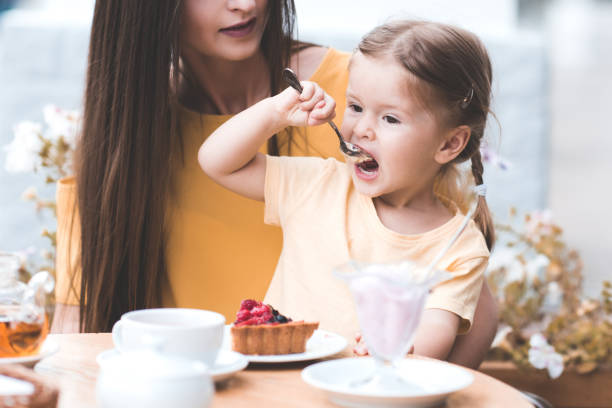 istock Mother with daughter in cafe 1179193089