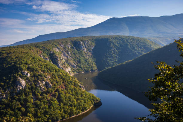 istock River surrounded by the hills and mountains 1179193322