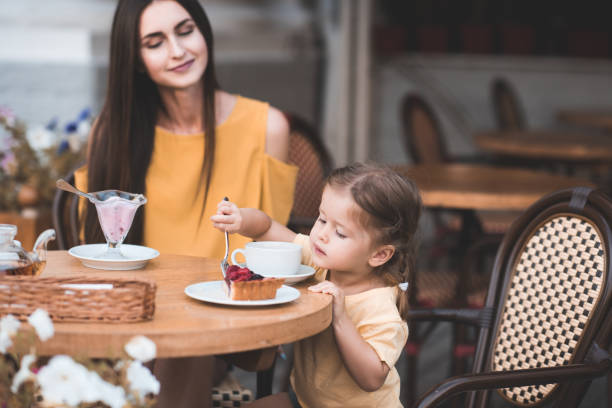 istock Mother with daughter in cafe 1179193444