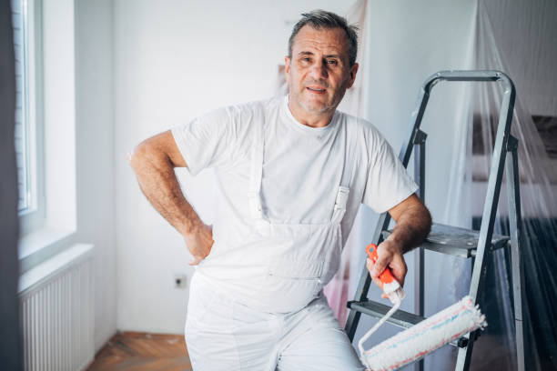 istock Senior painter taking a break from painting 1179195135