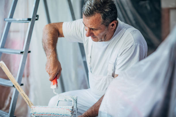 istock Senior handyman painting 1179196463