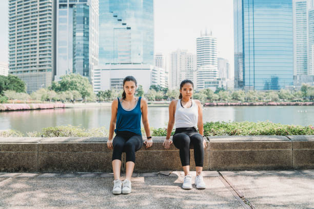 istock Young women exercising together outdoor 1179196647
