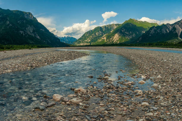 Beautiful alpine landscape with clean cold river in the mountain valley. Tagliamento river, Gemona, Italy Beautiful alpine landscape with clean cold river in the mountain valley. Tagliamento river, Gemona, Italy gemona del friuli stock pictures, royalty-free photos & images