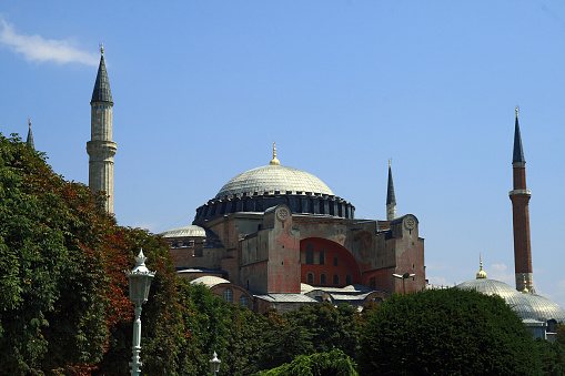 The Hagia Sophia Grand Mosque / Ayasofya-i Kebir Cami-i Şerifi, with its innovative architecture, rich history, religious significance and extraordinary characteristics has been fighting against time for centuries, is the largest Eastern Roman Church in Istanbul. Constructed three times in the same location, it is the world’s oldest and fastest-completed cathedral. With its breathtaking domes that look like hanging in the air, monolithic marble columns and unparalleled mosaics, is one of the wonders of world’s architecture history. Hagia Sophia (/ˈhɑːɡiə soʊˈfiːə/; from Koinē Greek: Ἁγία Σοφία, romanized: Hagía Sophía; Latin: Sancta Sophia, lit. 'Holy Wisdom'), officially the Hagia Sophia Holy Grand Mosque (Turkish: Ayasofya-i Kebir Cami-i Şerifi)[3] and formerly the Church of Hagia Sophia,[4] is a Late Antique place of worship in Istanbul, designed by the Greek geometers Isidore of Miletus and Anthemius of Tralles.[5] Built in 537 as the patriarchal cathedral of the imperial capital of Constantinople, it was the largest Christian church of the eastern Roman Empire (the Byzantine Empire) and the Eastern Orthodox Church, except during the Latin Empire from 1204 to 1261, when it became the city's Roman Catholic cathedral. In 1453, after the Fall of Constantinople to the Ottoman Empire, it was converted into a mosque. In 2020, it re-opened as a mosque.