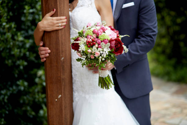 couple embracing. groom and bride with bouquet of flowers - haute couture beautiful smoking beauty imagens e fotografias de stock