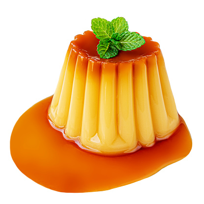 Pudding caramel custard with caramel sauce and mint leaf isolated on white background