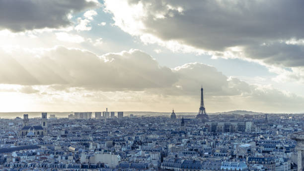 istock Sepia toned Paris Cityscape: Eiffel tower, roofs and cloudy sky 1179208085