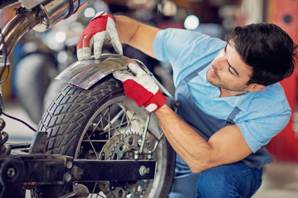 istock Man is working on a custom made motorbike 1179210231