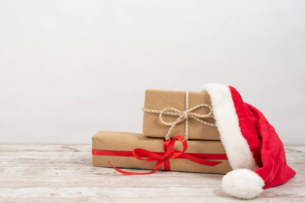 istock Gift box wrapped in recycled paper with ribbon bow 1179211316
