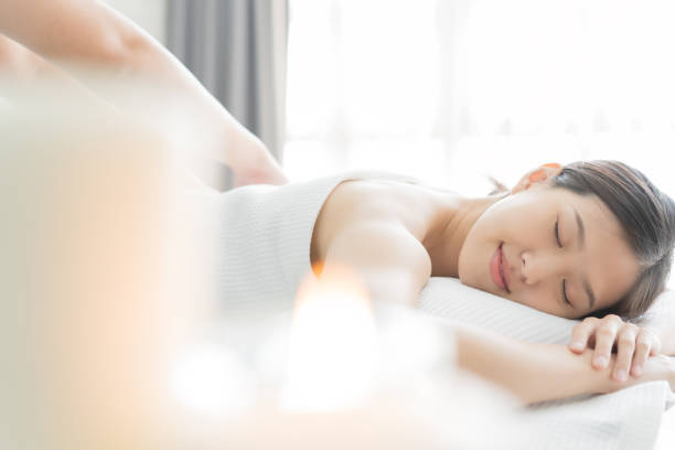 istock Young Asian woman in spa salon getting massage. 1179215686