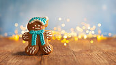 Christmas gingerbread cookies with Christmas decorations on wooden background