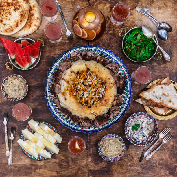 istock Pilaf with lamb in traditional plate with appetizers, top view flat lay 1179218037