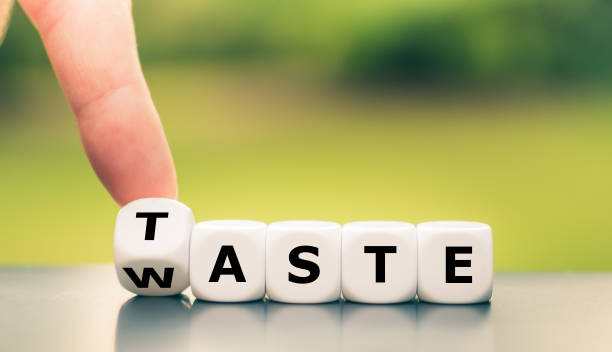 istock From waste to taste. Hand turns a dice and changes the word 