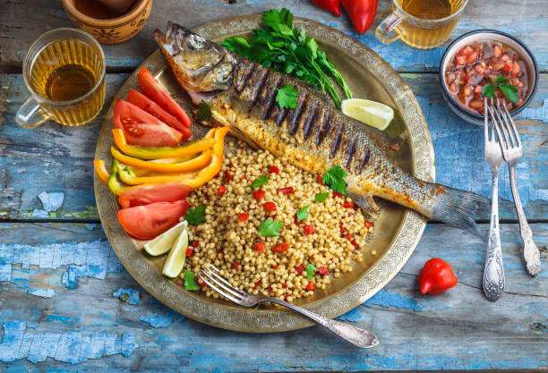 istock Grilled sea bass on coper plate, moroccan style 1179223485