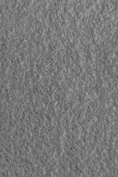 istock Gray porous cement wall with bumps 1179233096
