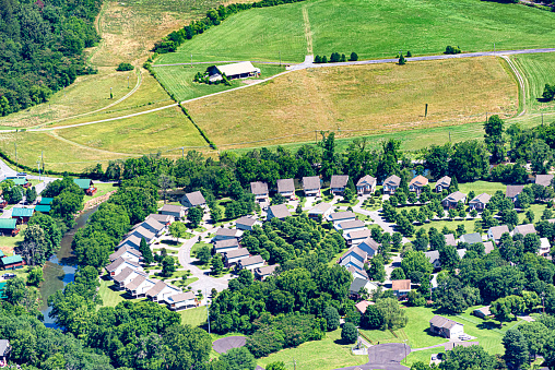 Horizontal Aerial Image Showing Urban Sprawl As New Homes Overrun Farm Land