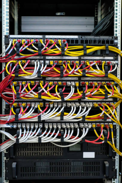 istock Many wires connect to the network interfaces of powerful Internet servers. Racks with computer equipment in the server room data center. 1179234219