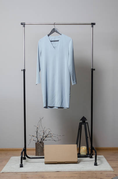 istock dress on hangers on garment rack 1179234369