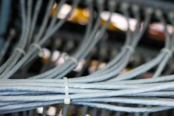 istock Network routers of ISP. Many wires connect to the network interfaces of powerful Internet servers. Racks with computer equipment in the server room data center. 1179235619