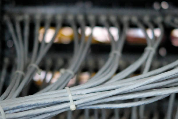 istock Network routers of ISP. Many wires connect to the network interfaces of powerful Internet servers. Racks with computer equipment in the server room data center. 1179235981