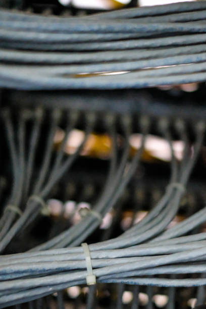 istock Network routers of ISP. Many wires connect to the network interfaces of powerful Internet servers. Racks with computer equipment in the server room data center. 1179236423