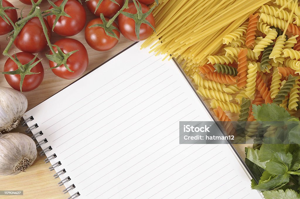 Pasta with blank recipe book and chopping board Selection of pasta with blank recipe book or shopping list on a chopping board.  If you’d like to see my complete collection of blank books with a variety of different foods, please CLICK HERE.   Alternative version of this file shown below: Above Stock Photo