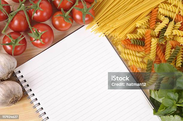 Pasta With Blank Recipe Book And Chopping Board Stock Photo - Download Image Now - Above, Angle, At The Edge Of