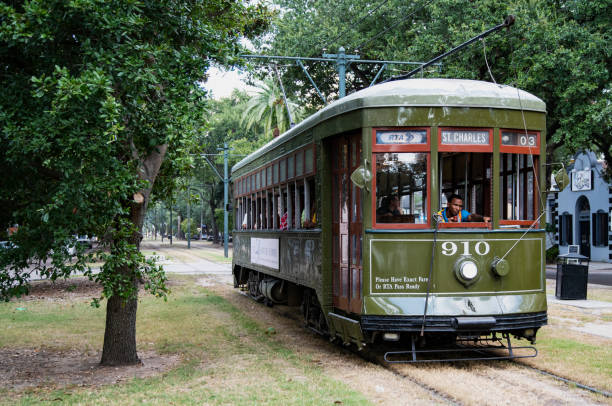 New Orleans streetcar 2 Green streetcar on the St. Charles Avenue line in New Orleans. The line is one of five streetcar lines in New Orleans. The St. Charles line began operating in 1835 and is the oldest continuously operating streetcar line in the world. Each car operates as an historical landmark. 
New Orleans, Louisiana
September 29, 2019. robertmichaud stock pictures, royalty-free photos & images