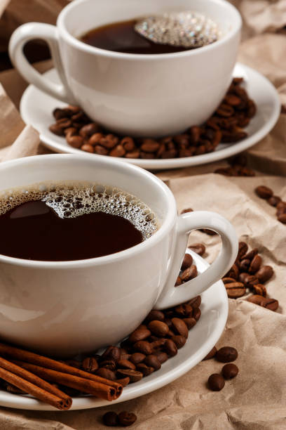 istock Two cups of coffee over crumpled paper 1179249865