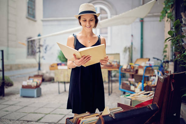 istock Woman is choosing books in a bookstore 1179249873