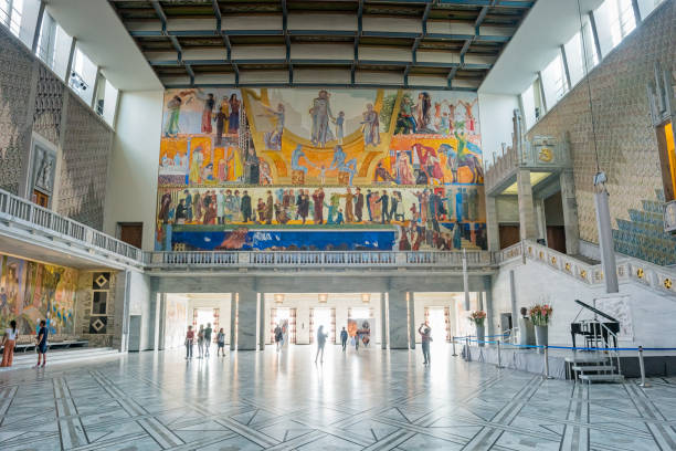 People visit the main hall of Oslo City Hall in Oslo Norway.