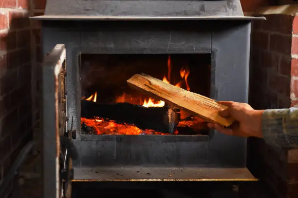 A close up image of an old fashioned wood burning stove.