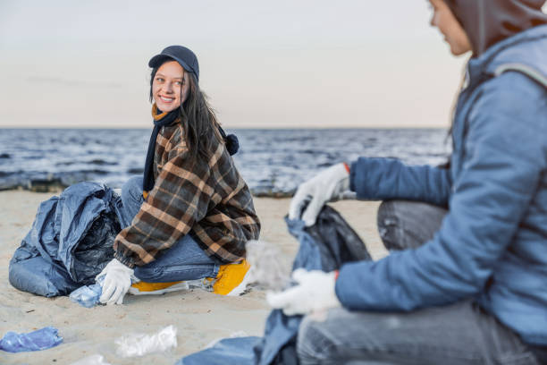 istock Volunteers cleaning plastic at the beach 1179252664