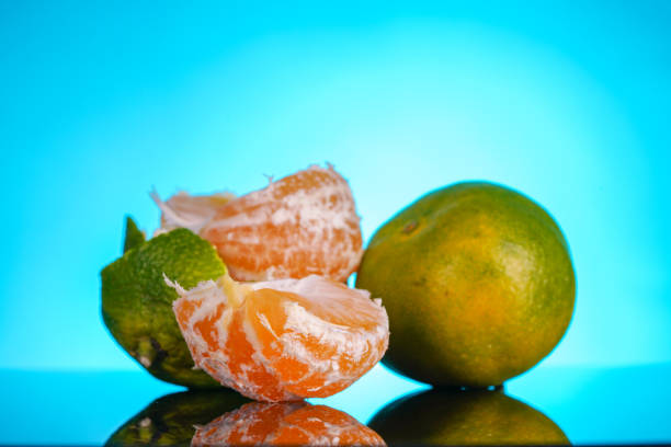 Detailed macro of a ripe mandarin with vivid orange peel and juicy texture, perfect for food, health, and lifestyle concepts