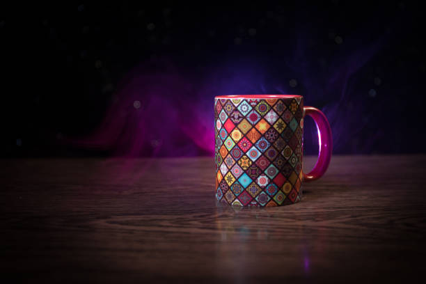 istock Beautiful eastern style textured ceramic cup of coffee (or tea) with smoke over dark toned background. 1179254006