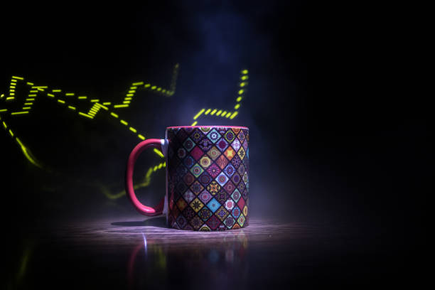 istock Beautiful eastern style textured ceramic cup of coffee (or tea) with smoke over dark toned background. 1179254013