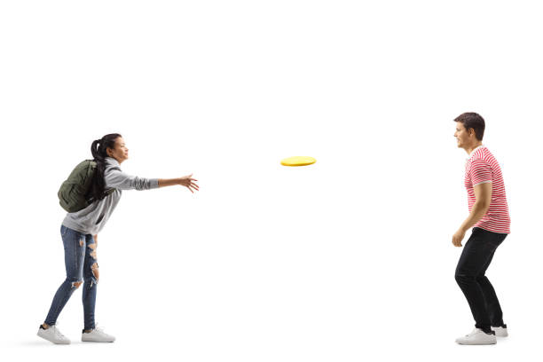 istock Female student throwing a plastic disc to a young man 1179254622