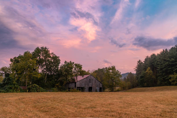 Sunset over an Old Barn near Hot Springs, North Carolina Early autumn sunset over an old wooden barn near Hot Springs, North Carolina, close to the Tennessee border north carolina us state stock pictures, royalty-free photos & images