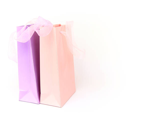 istock Pastel pink and lilac shopping bags isolated on white 1179260430