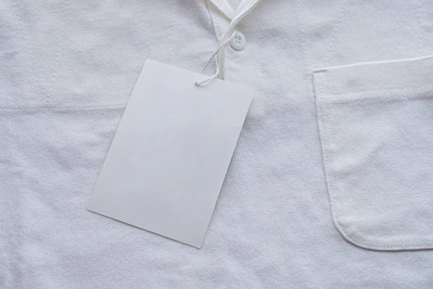 istock Blank white clothes tag label on new shirt 1179260484