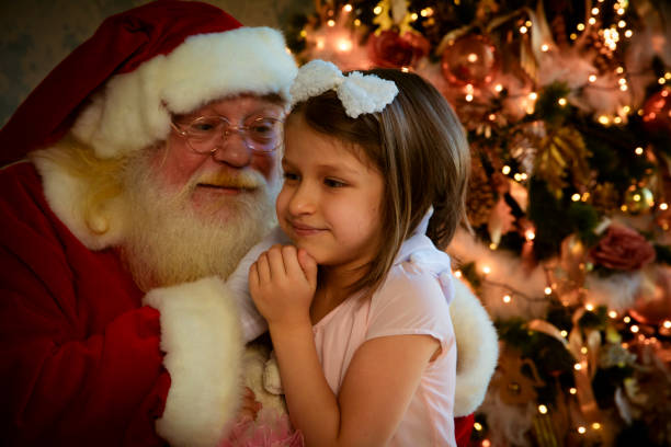 istock Santa Claus gives presents 1179260852