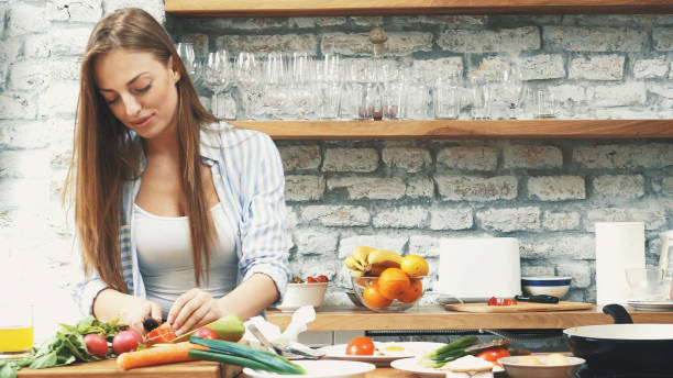 istock Young couple making dinner together at home 1179265006