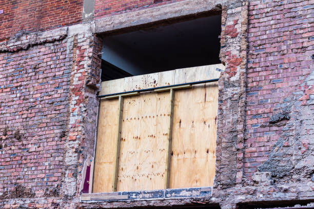 istock Boarded up opening in a partly demolished building 1179266081