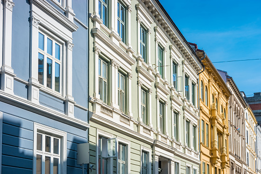 Stock photograph of ornate townhouses in a residential district, downtown Oslo, Norway on a sunny day.